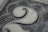 Close-up of a crisp US dollar bill highlighting the intricate engraving around the portrait.