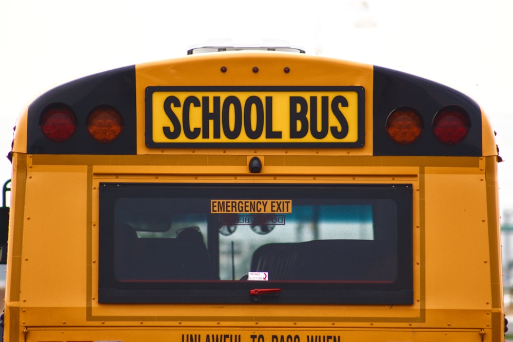 yellow school bus with black and white frame