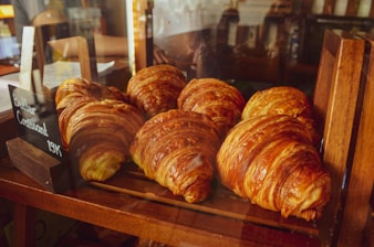 a bunch of croissants that are on a table