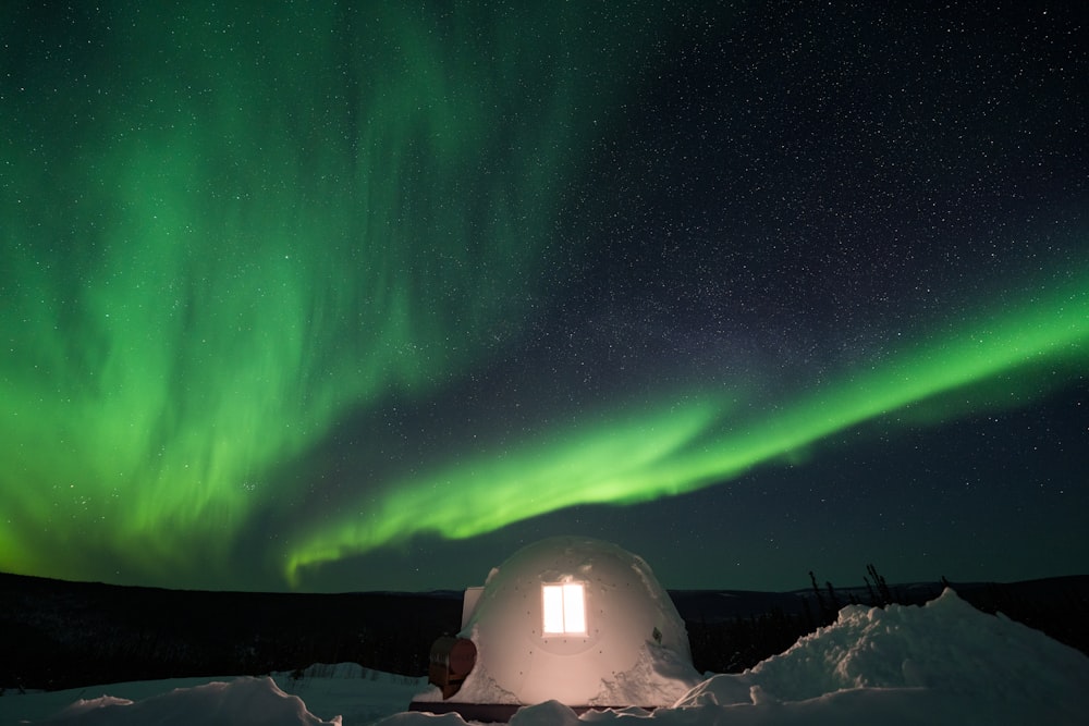 white dome tent under green sky