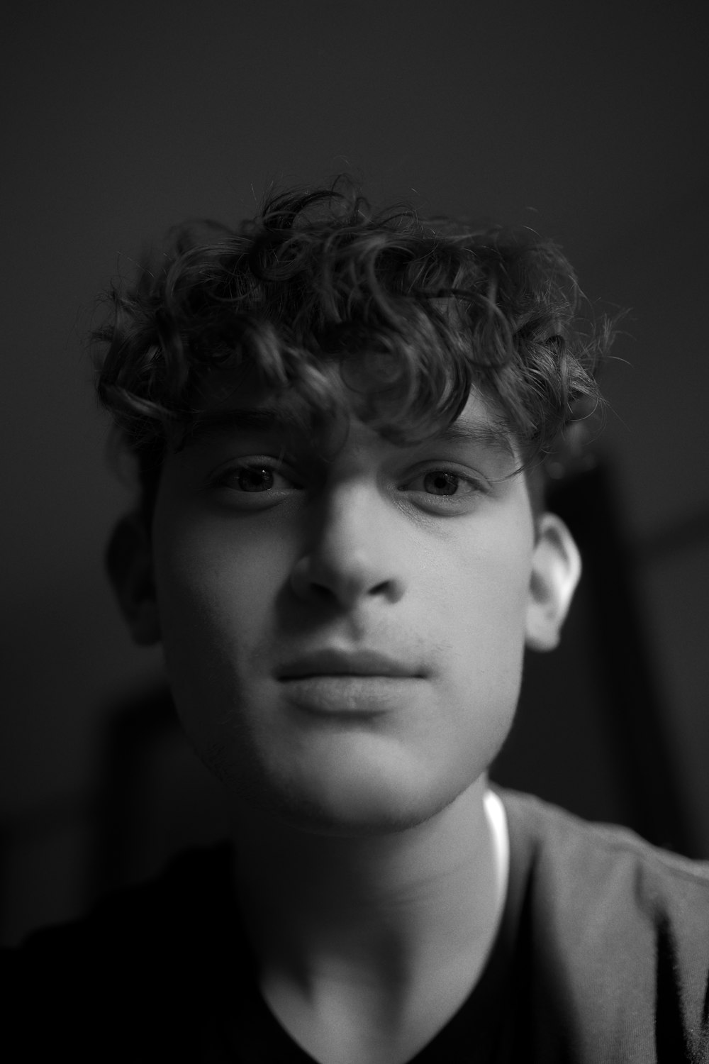 grayscale photo of man in collared shirt