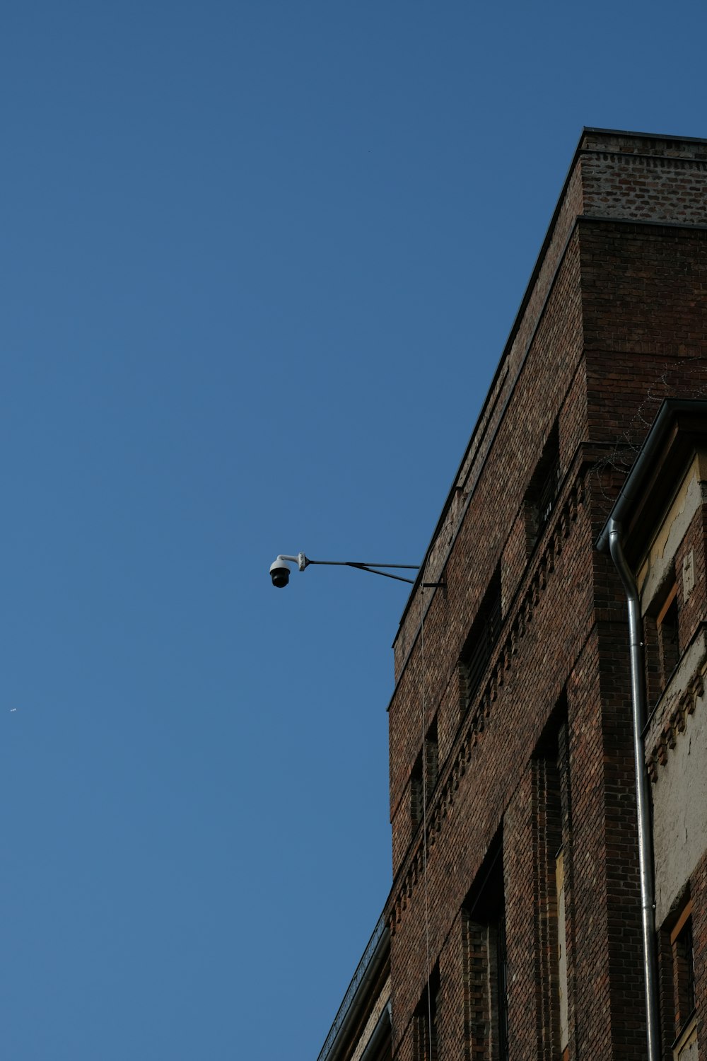 brown concrete building under blue sky during daytime