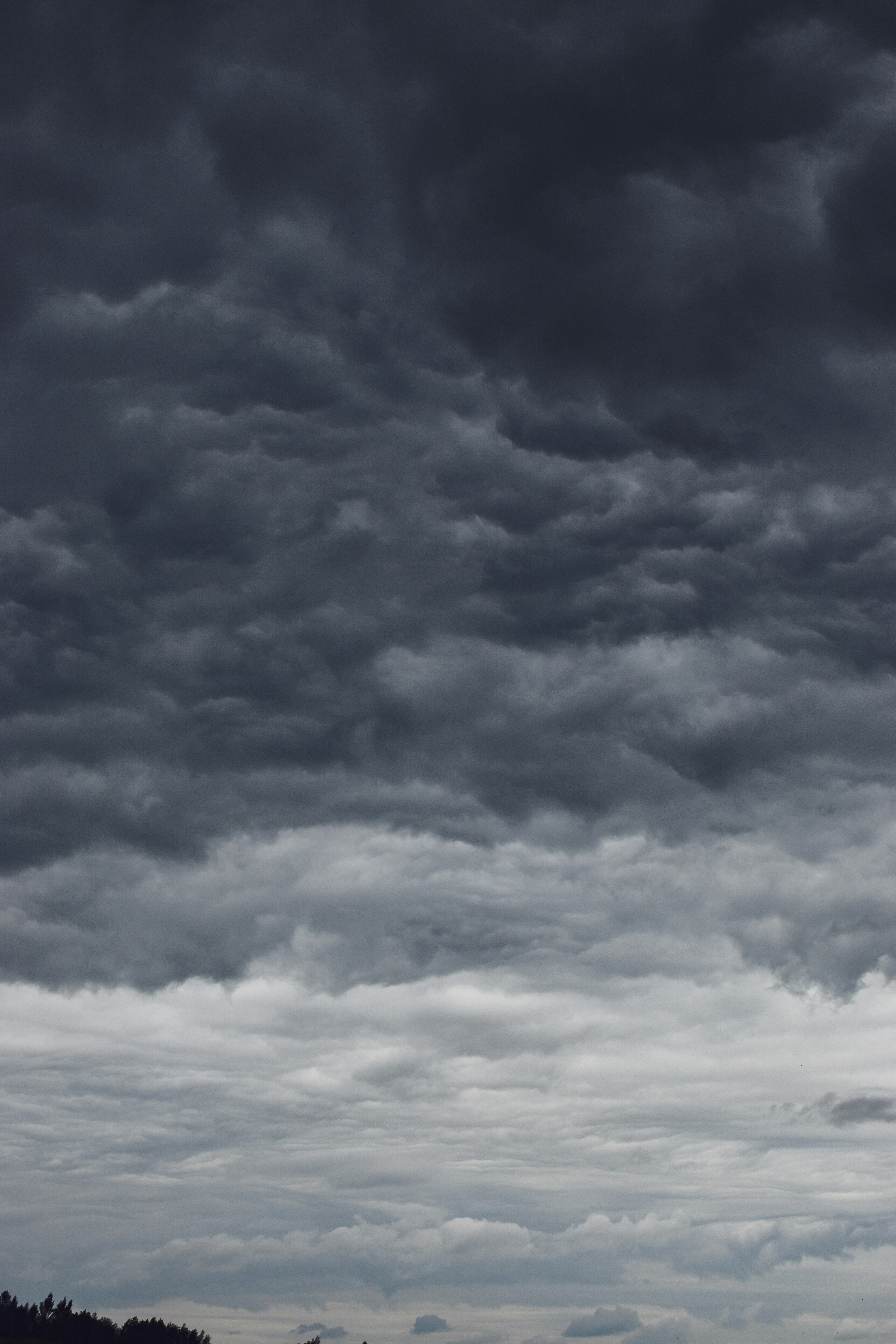 Expansive dark stormy landscape with dramatic clouds and moody lighting