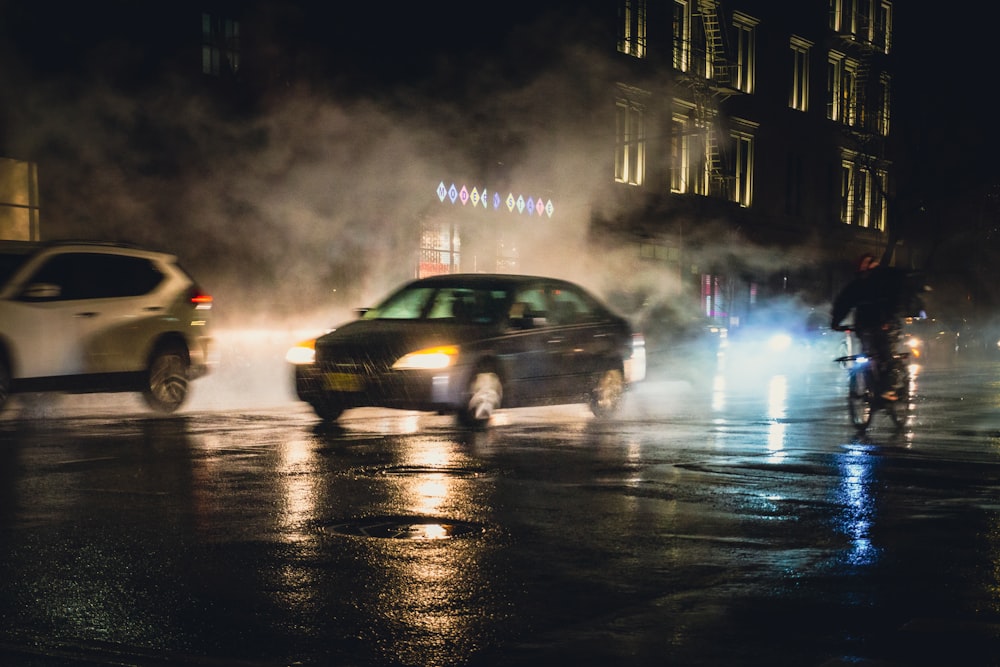 black sedan on road during night time