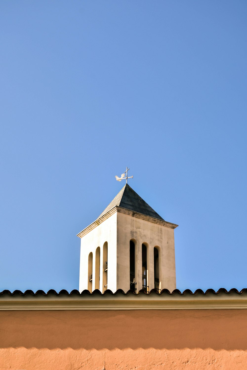 white and brown concrete church under blue sky during daytime