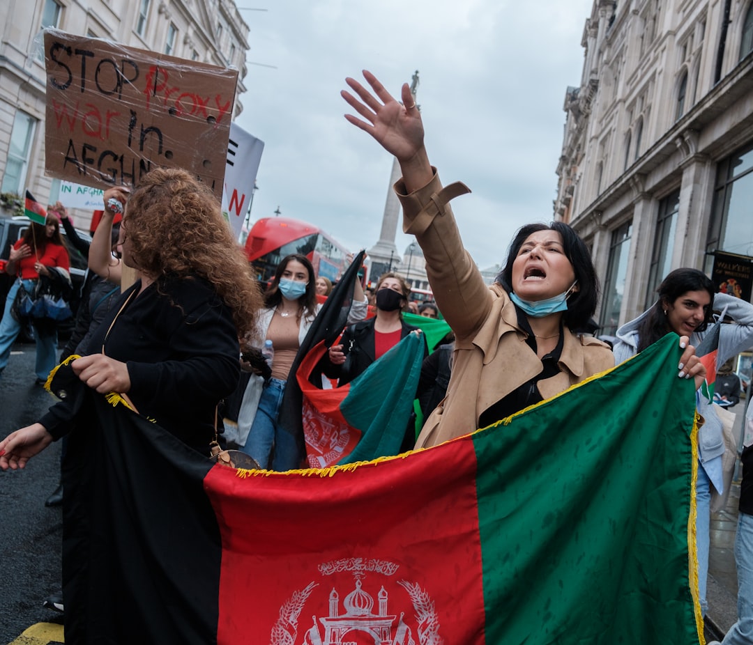 people holding flags during daytime