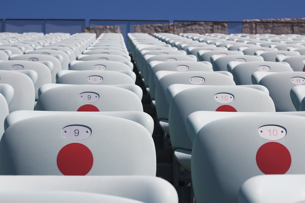 white plastic chairs on a sunny day