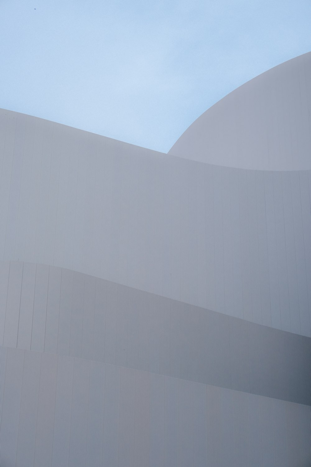 white concrete building under blue sky during daytime