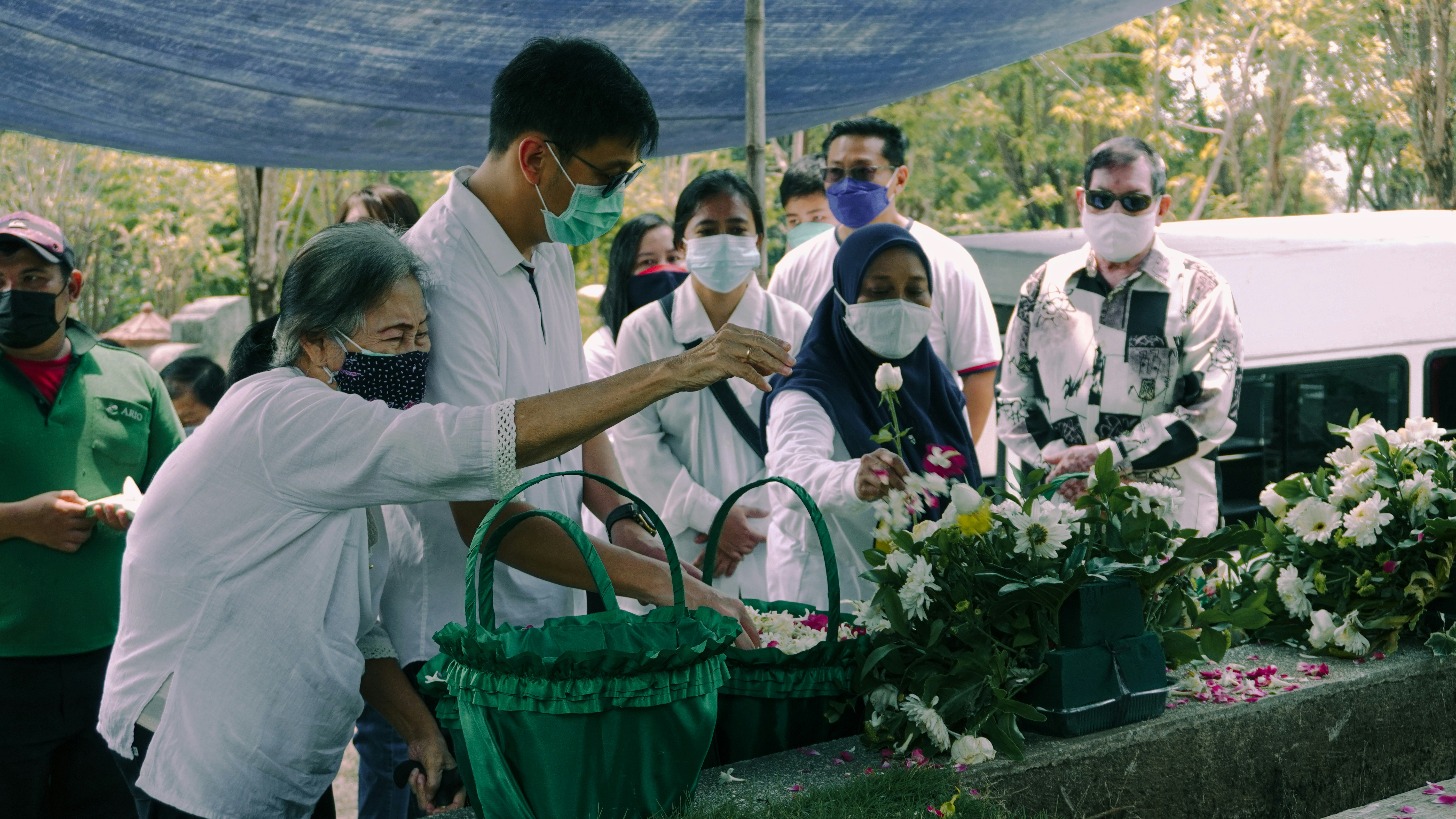 people gathering in a green basket during daytime