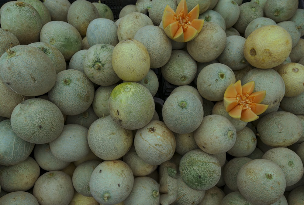 yellow round fruits on black plastic crate