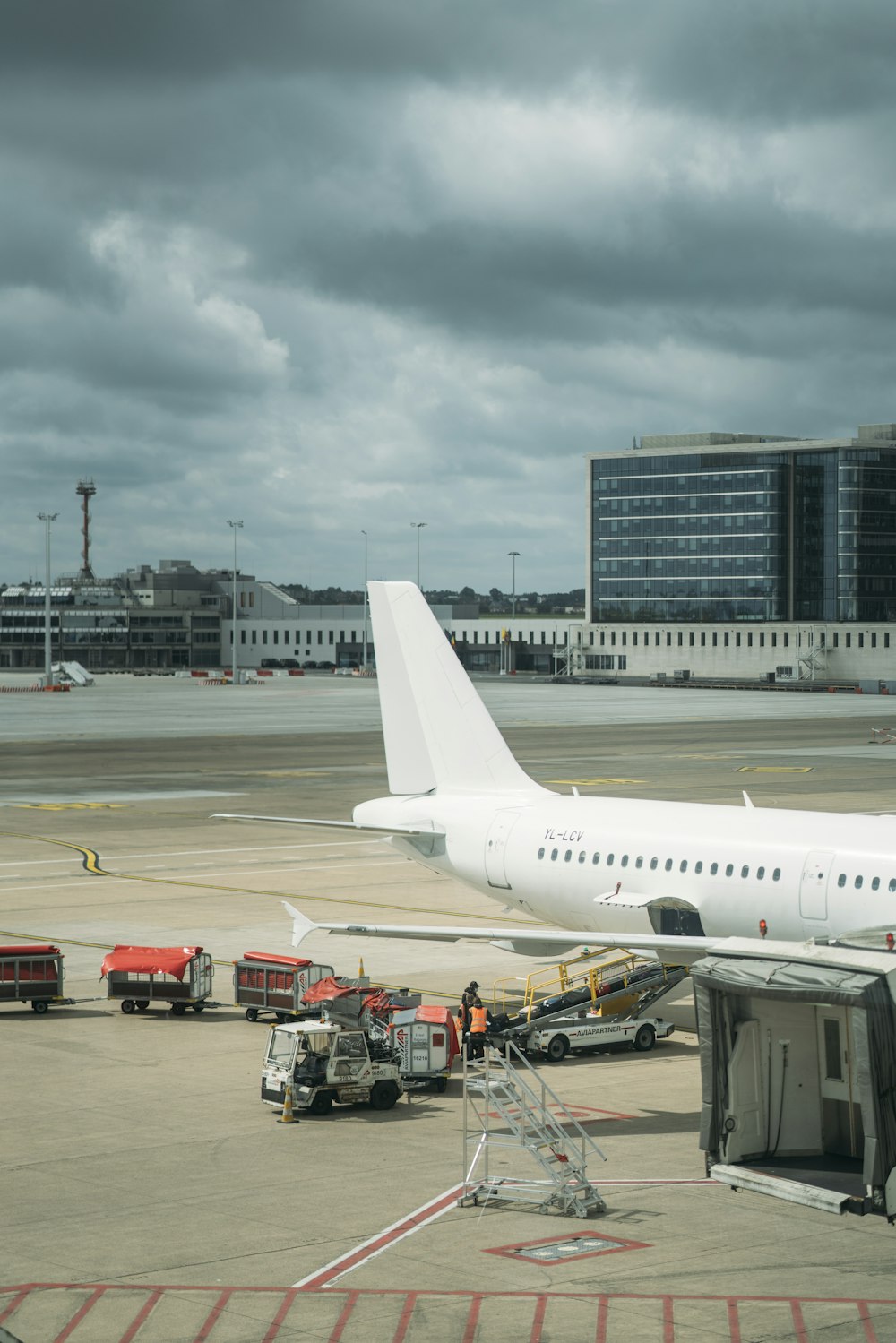 white passenger plane on airport during daytime