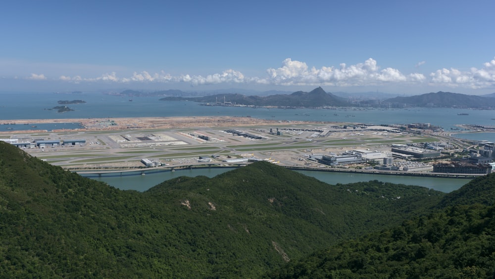 green mountains near body of water during daytime