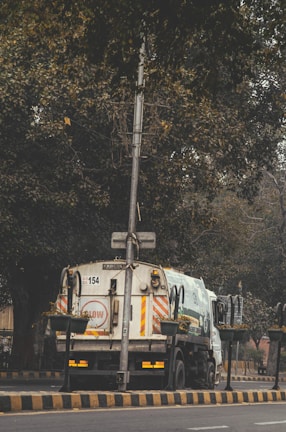 Dumpster service truck parked outside a residential home ready for debris pickup.