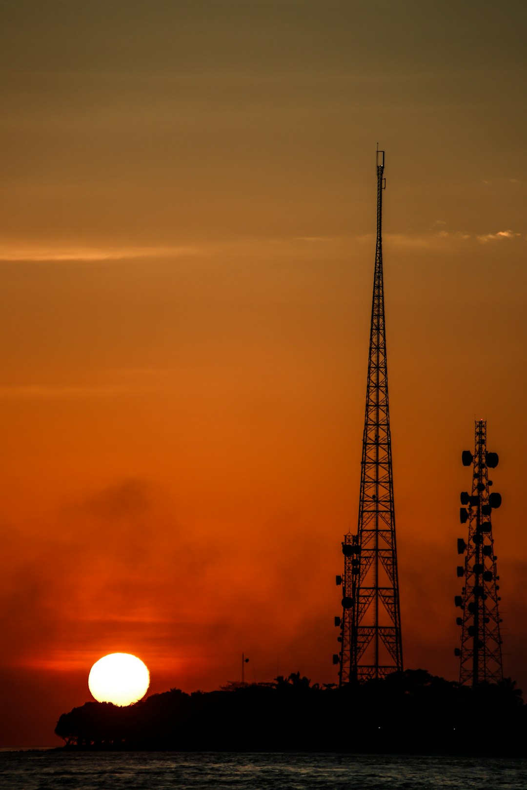 silhouette of tower during sunset