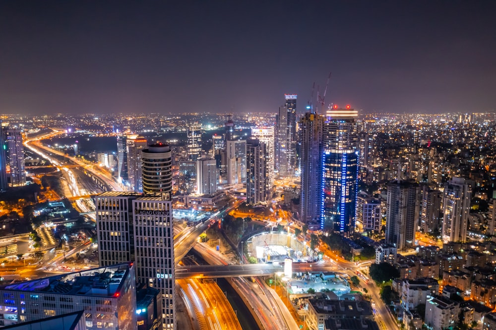 city with high rise buildings during night time