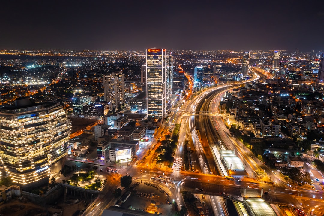 city with high rise buildings during night time