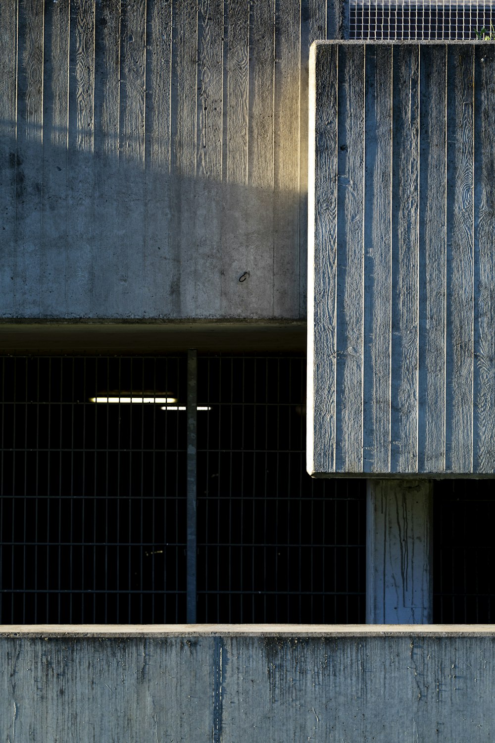 blue wooden board on gray wall