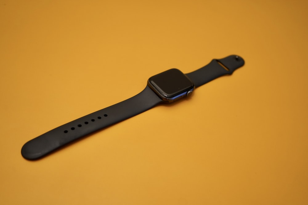 black apple watch with black sport band