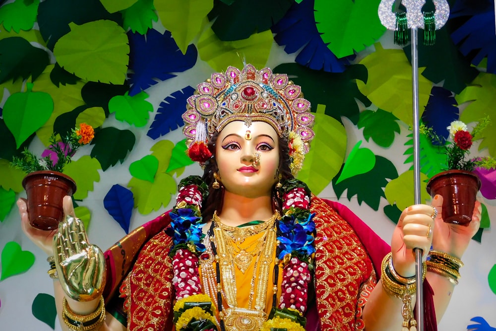 woman in red and gold sari dress