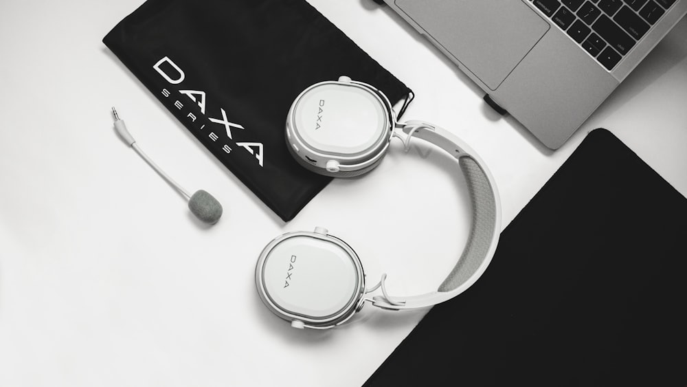 white and silver sony headphones