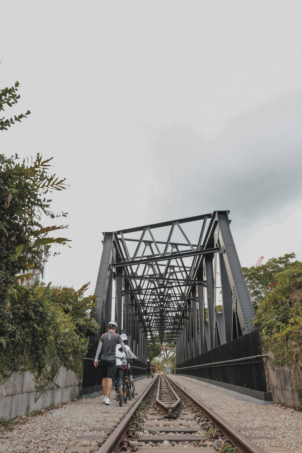 people walking on bridge during daytime