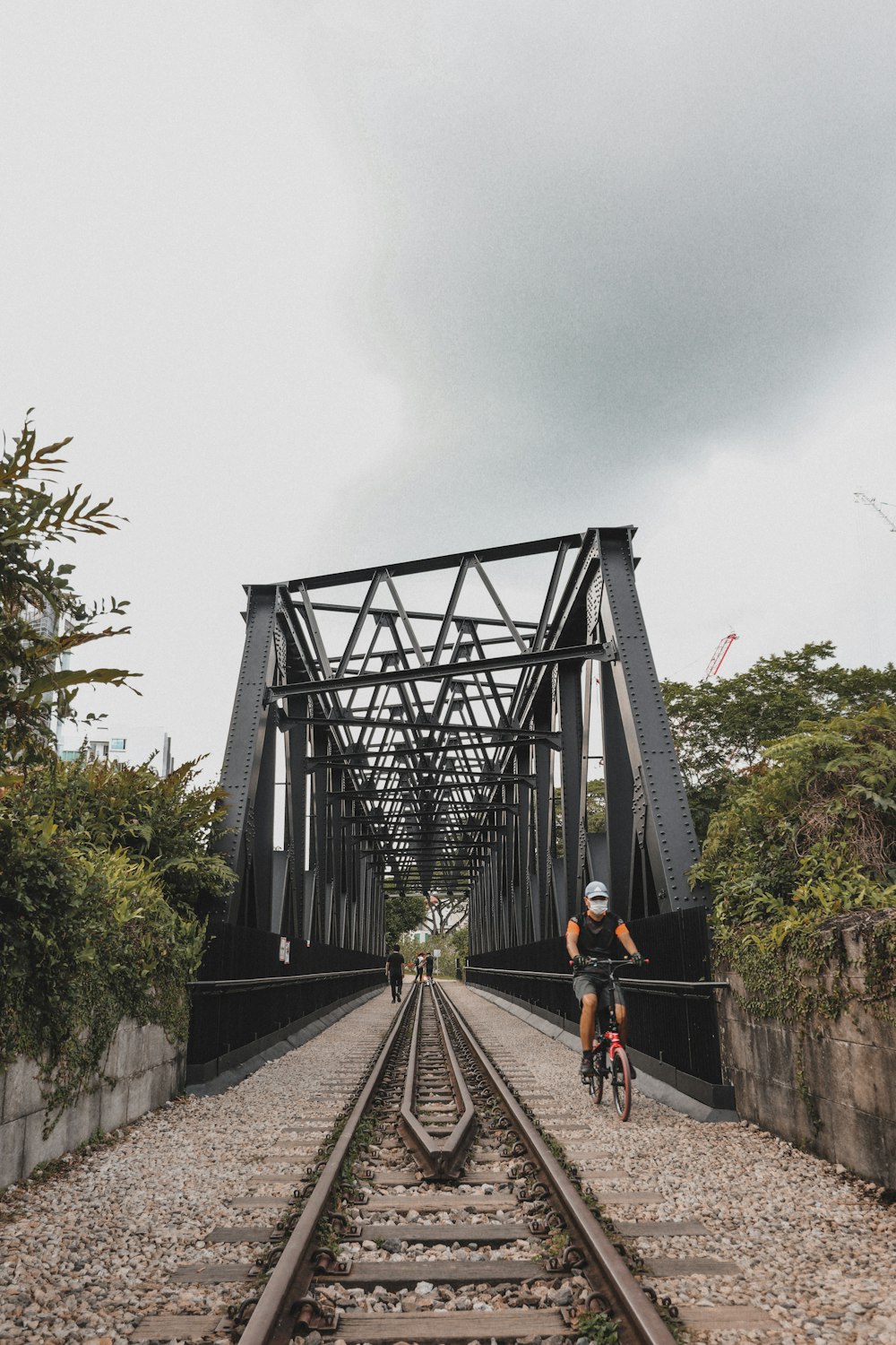 people walking on the bridge during daytime