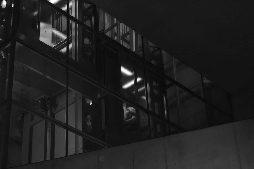 grayscale photo of glass window