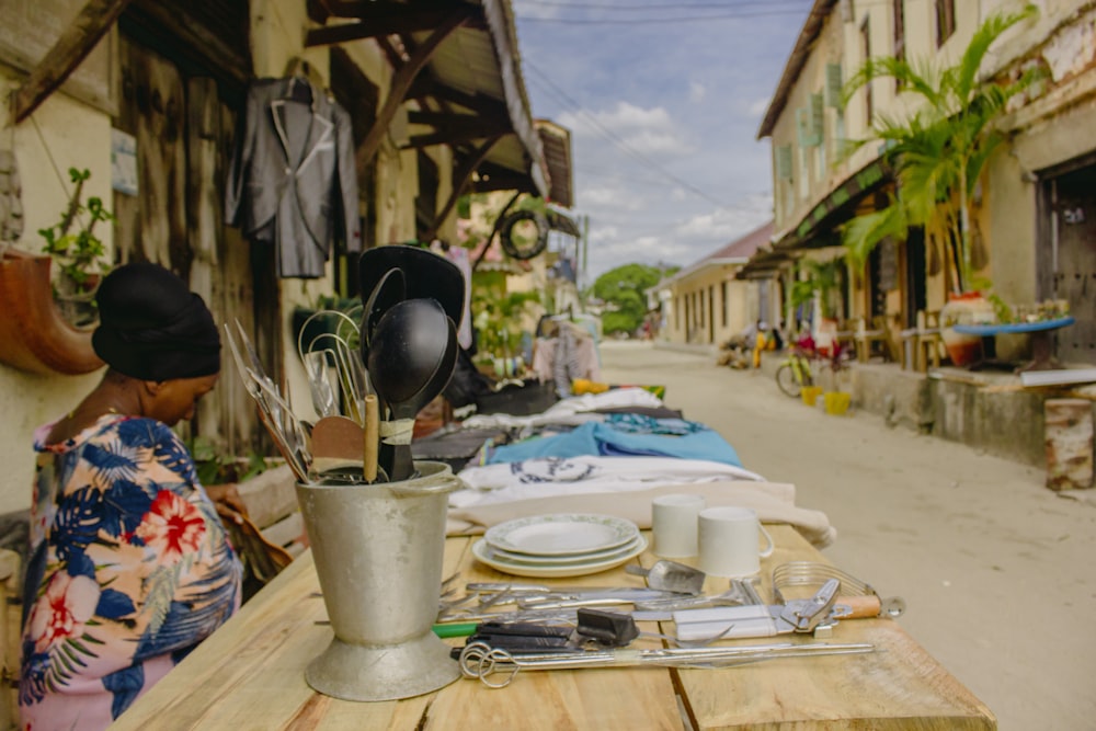 white plastic bucket on brown wooden table