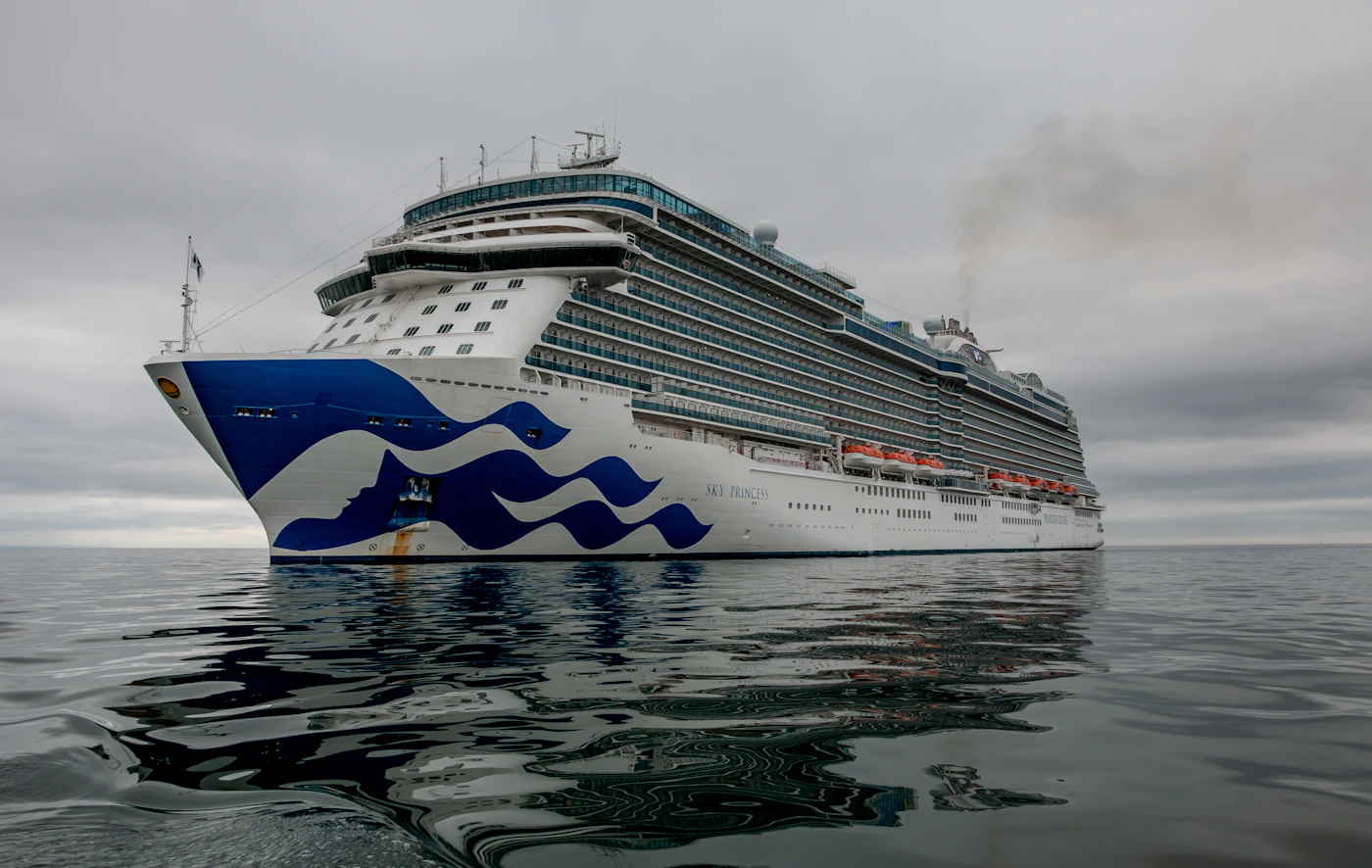 A cruise ship on calm blue water representing the strict six-month notice and one-year statute of limitations cruise tickets impose