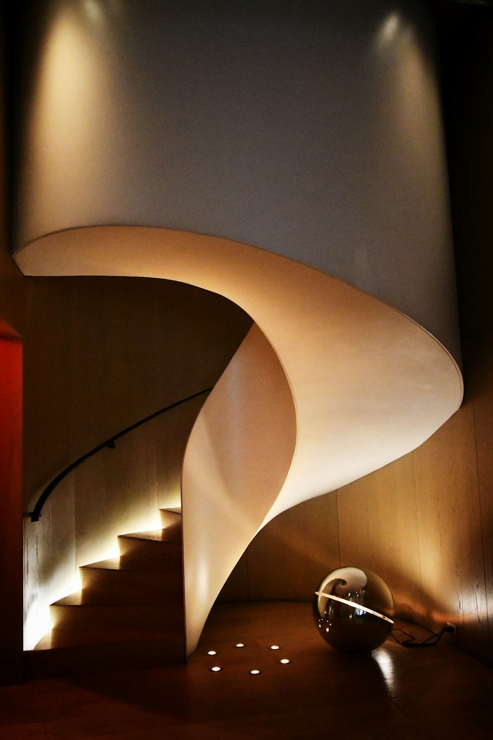 white spiral staircase with stainless steel railings