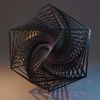black metal spiral staircase on white table