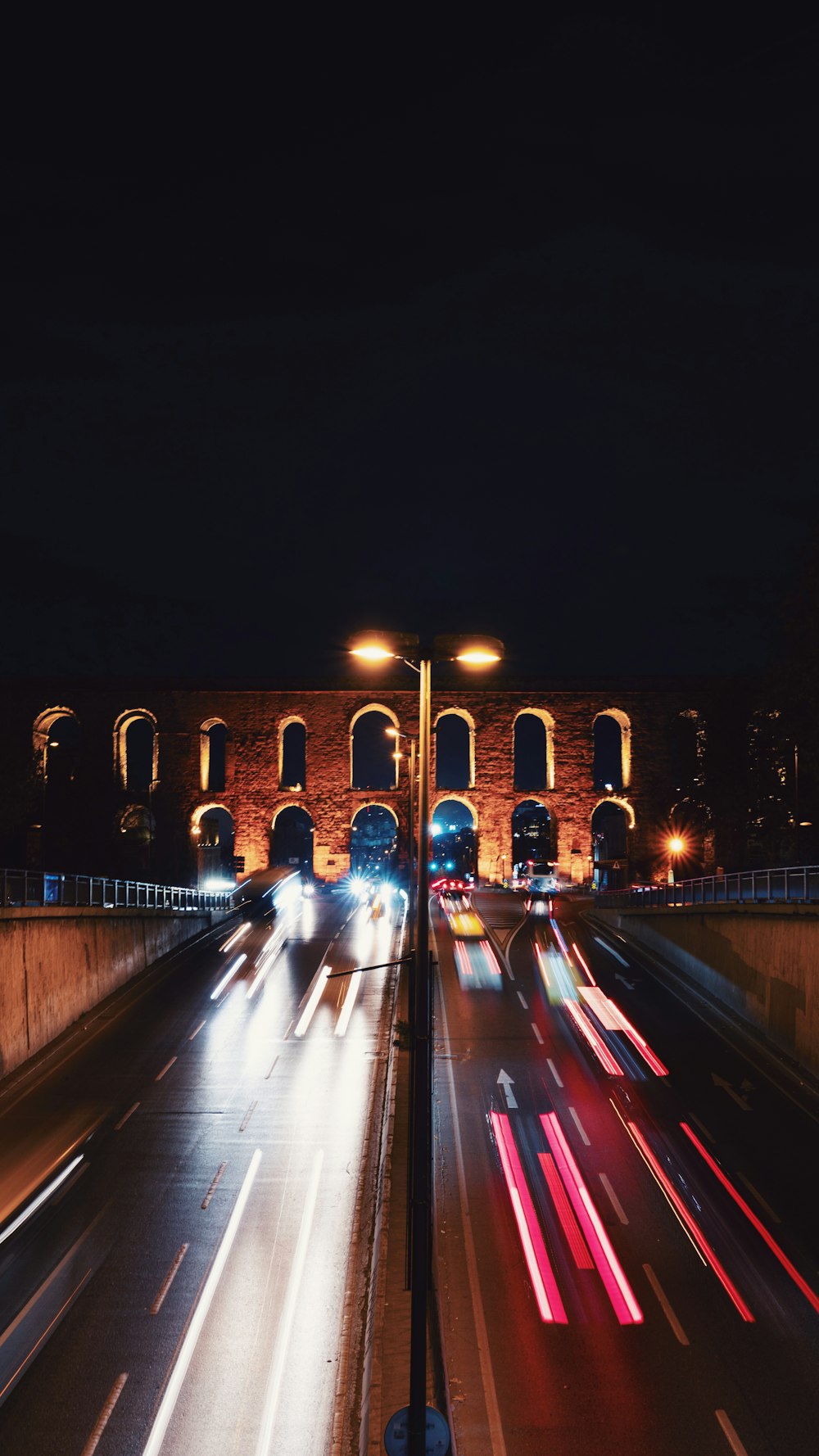 time lapse photography of cars on road during night time