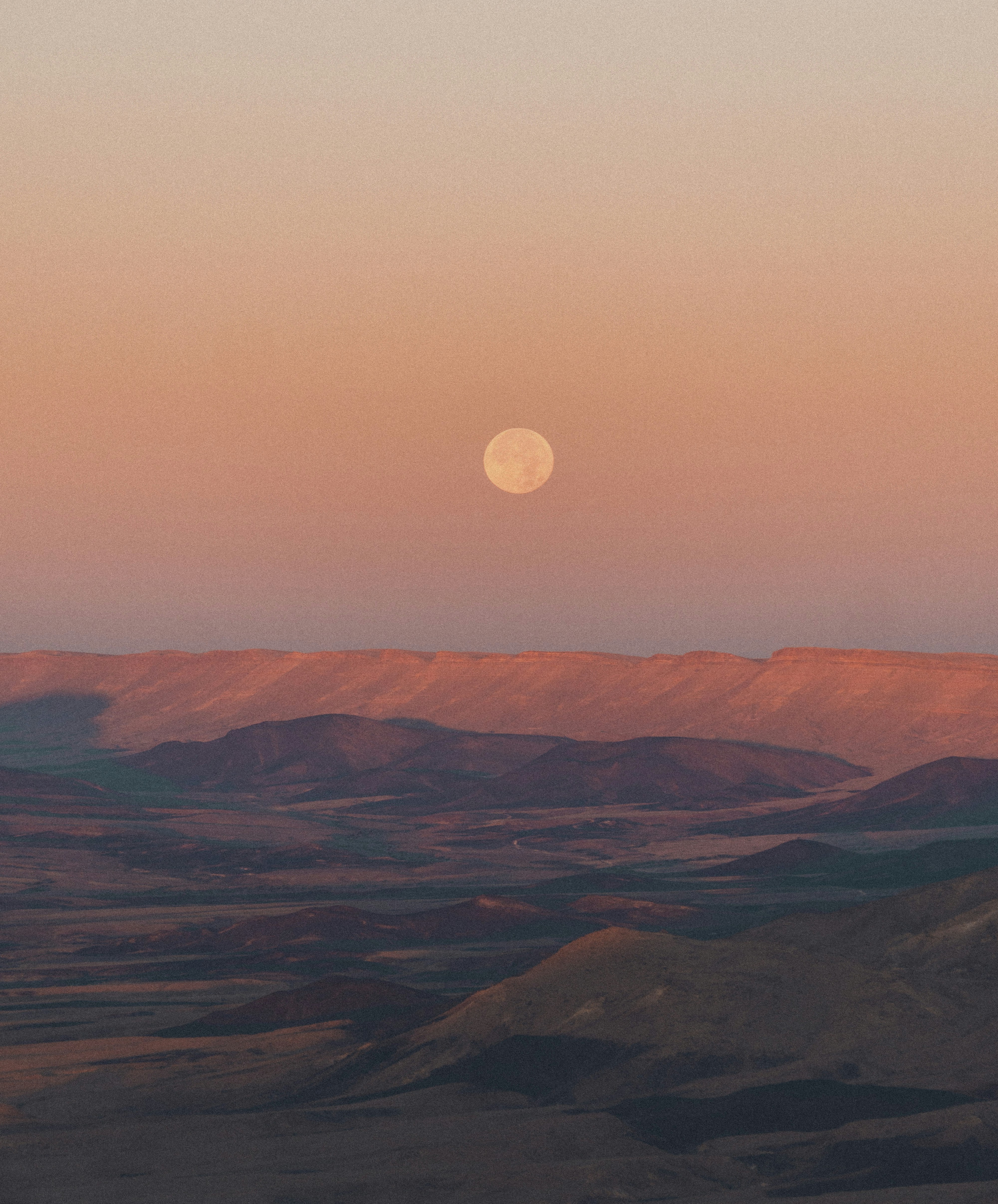 brown mountains under full moon