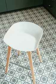 white chair on gray and black floor