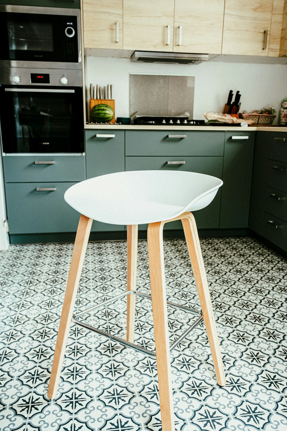 white wooden table near white wooden cabinet