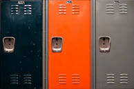 A sturdy metal locker with ventilation slots and lock holes.