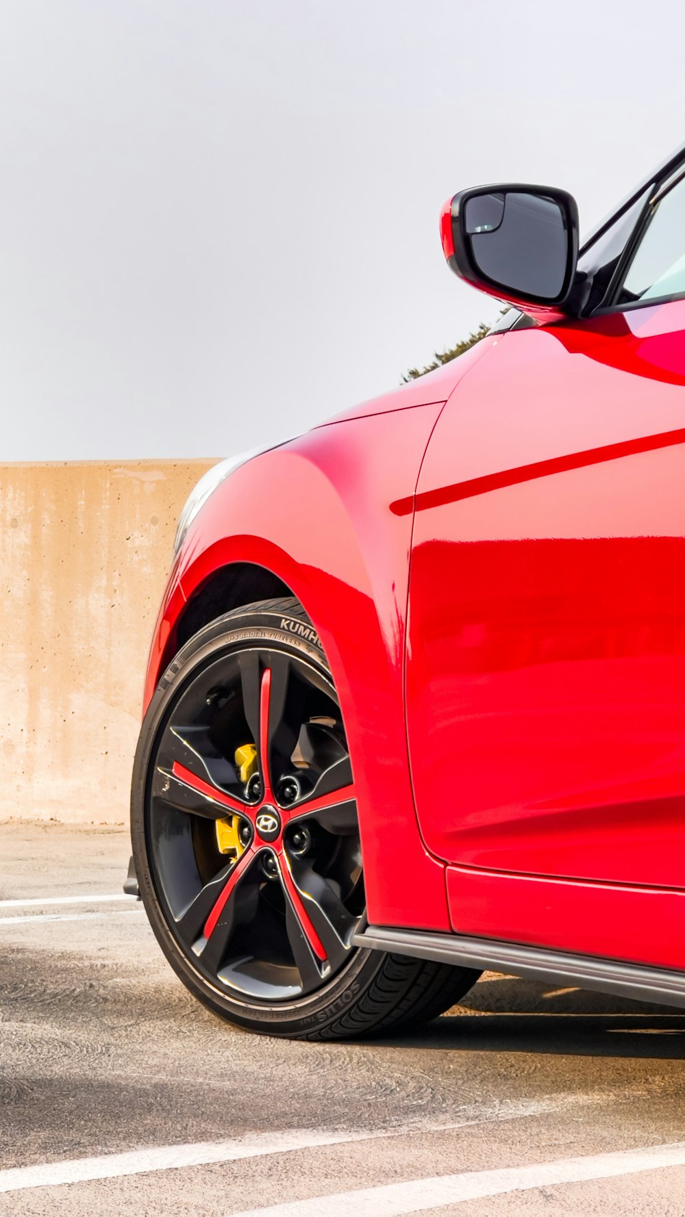 red car on gray concrete road