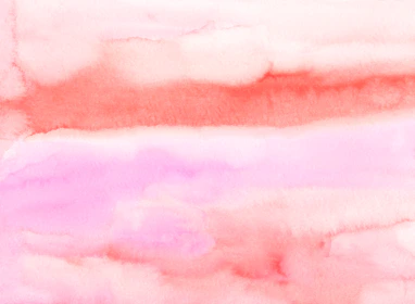 Soft brush strokes of makeup colors merging with subtle floral designs on a smooth background.
