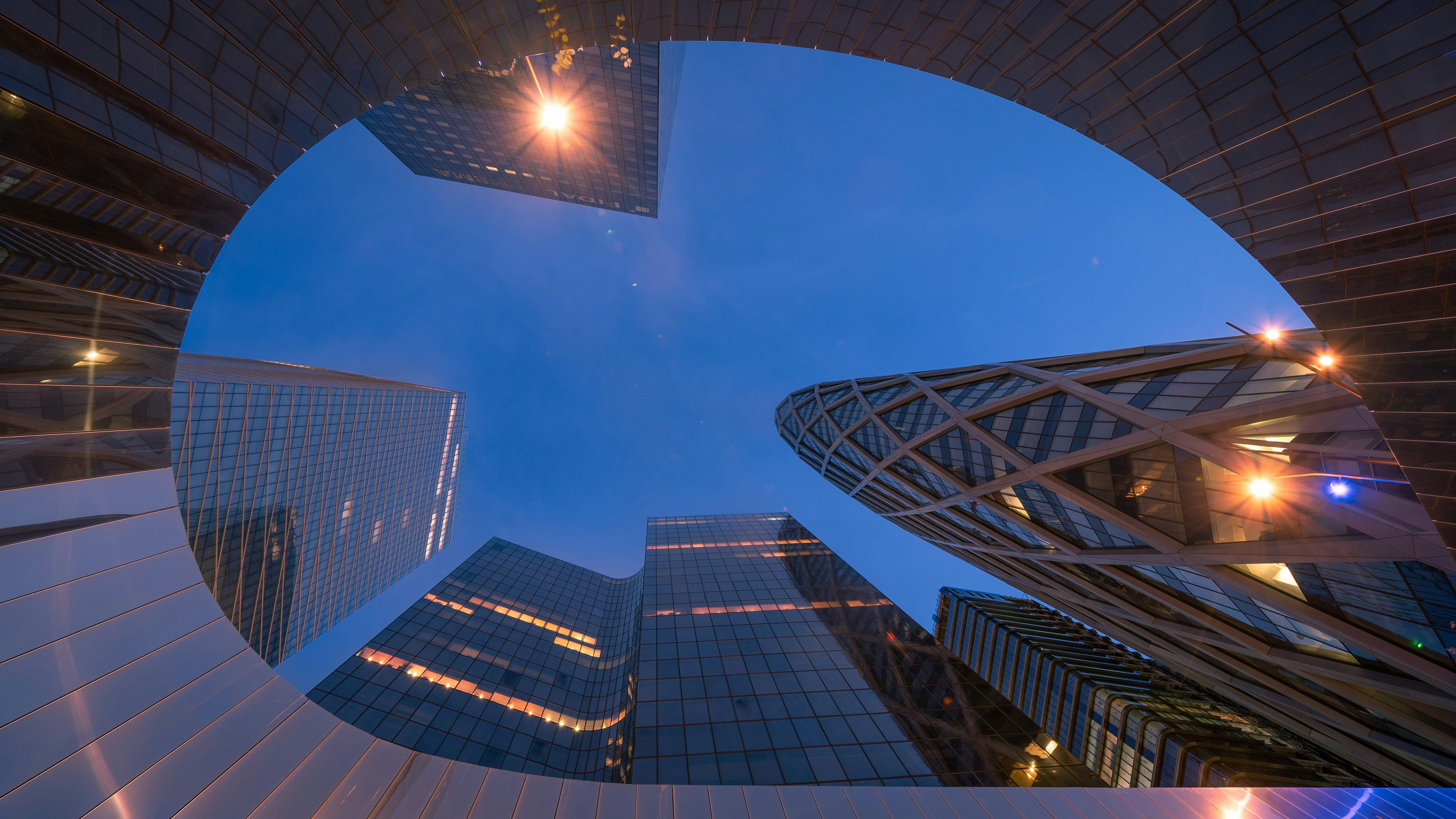 worms eye view of city buildings during night time