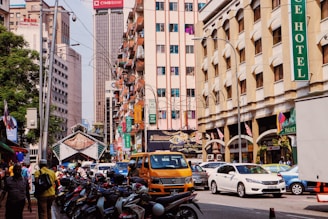 cars parked on street near buildings during daytime
