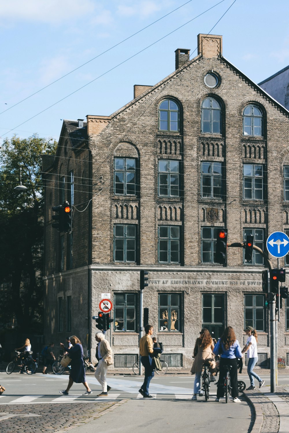 people walking on street near brown concrete building during daytime