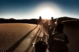 people walking on desert during daytime