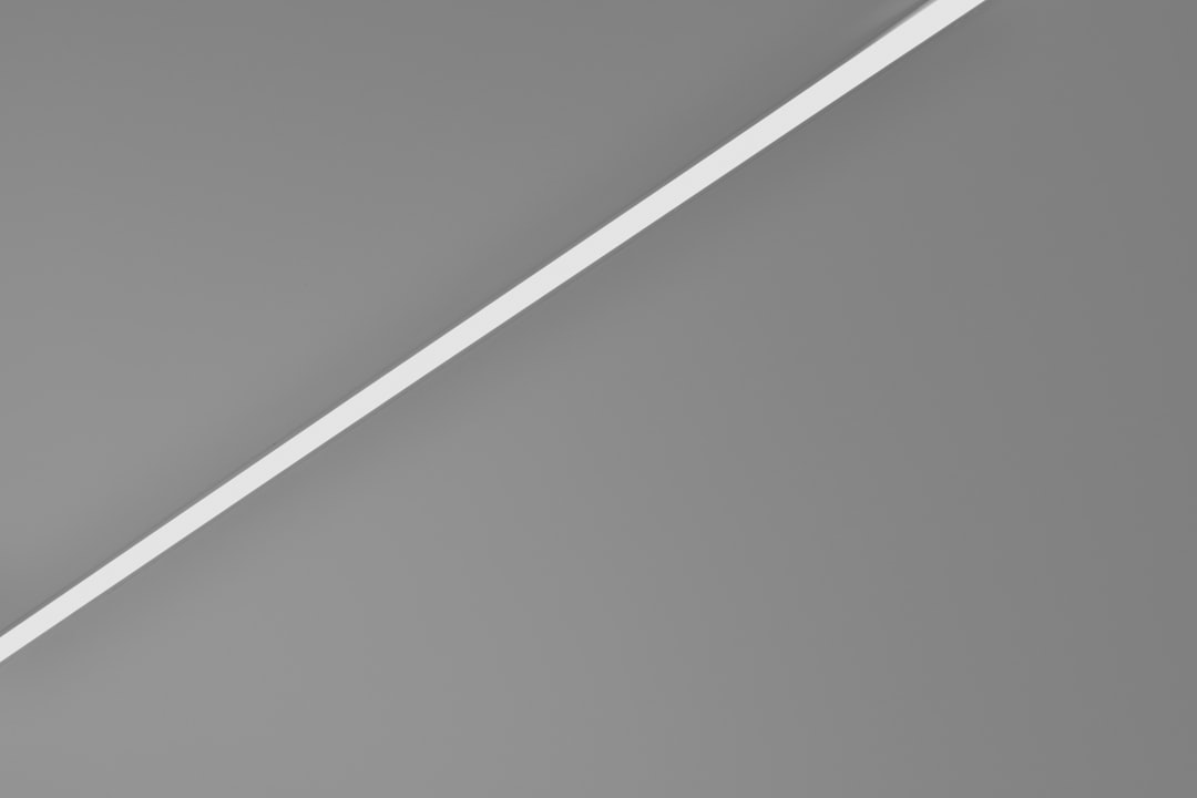 white coated wire on white surface