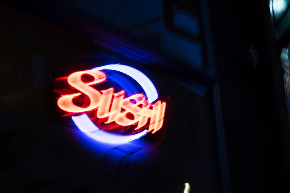 red and blue open neon light signage