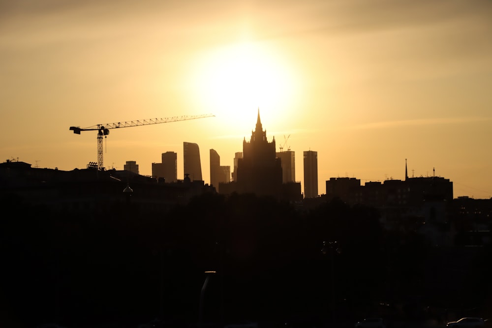 silhouette of city buildings during sunset