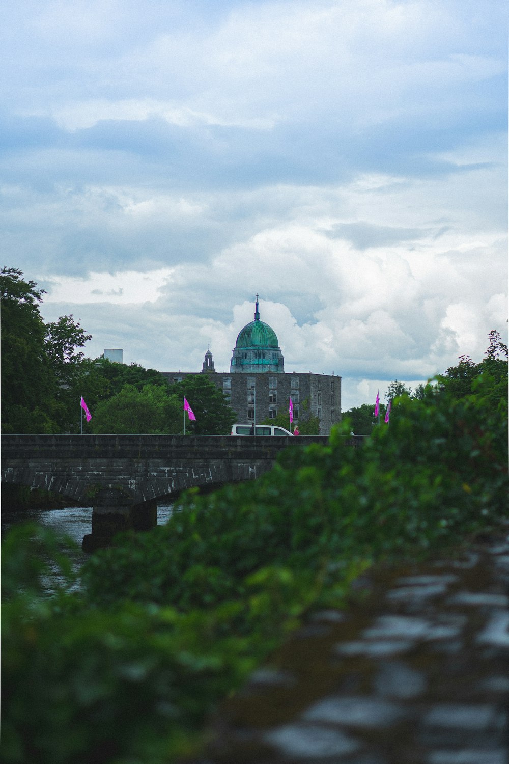 people walking on bridge over river