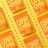 Several vibrant orange snack packages with the label 'LOVE CORN' are arranged diagonally on a bright yellow background. Each package is labeled as 'vegan cheesy flavored' and features corn kernels scattered around them.
