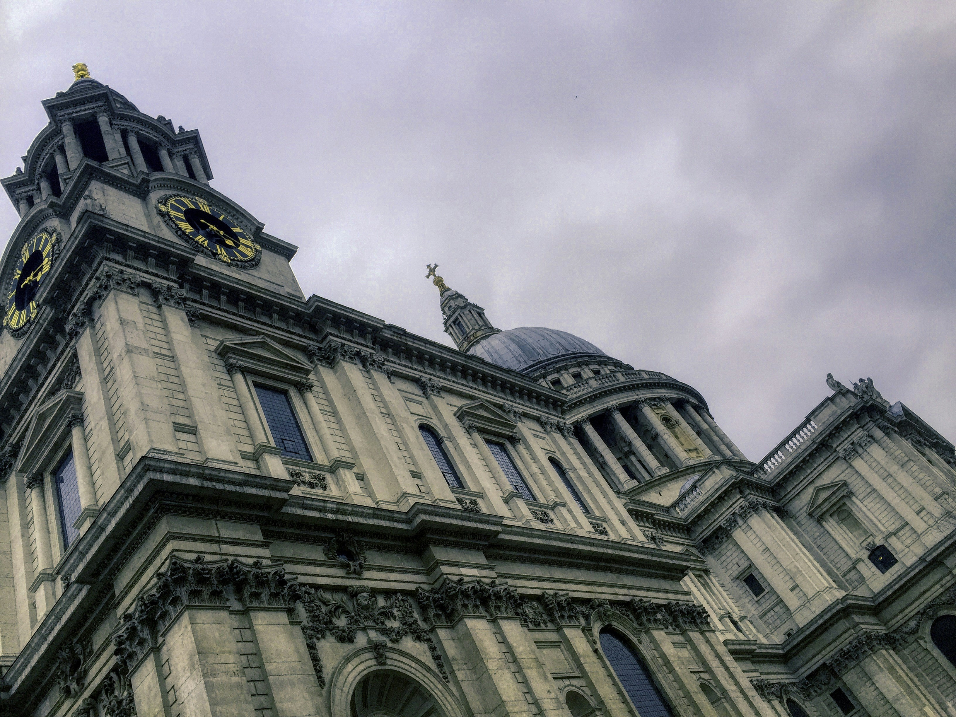 brown concrete building under white clouds during daytime