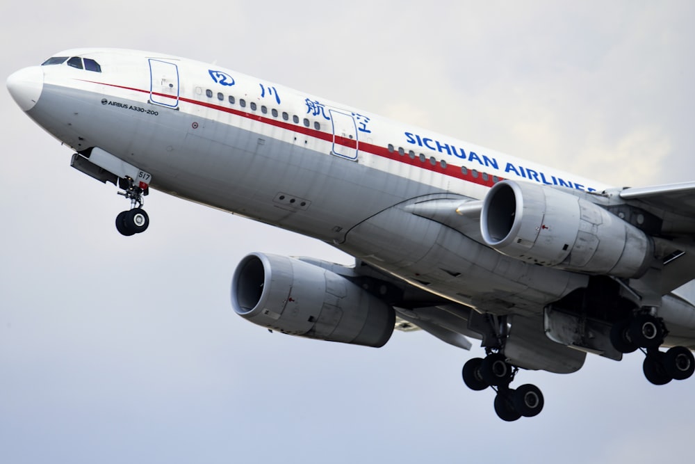 white and red passenger plane