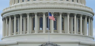 us a flag on white concrete building